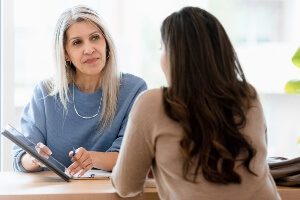 female client discussing guardianship with a female lawyer