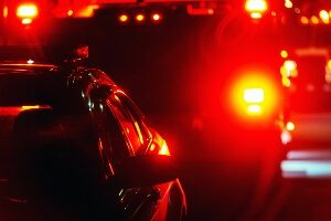 Canadian police at crash scene at night