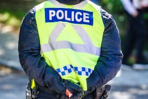 close-up image of the back of a police officer