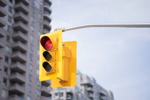 Red light with blurred downtown area in Canada in background