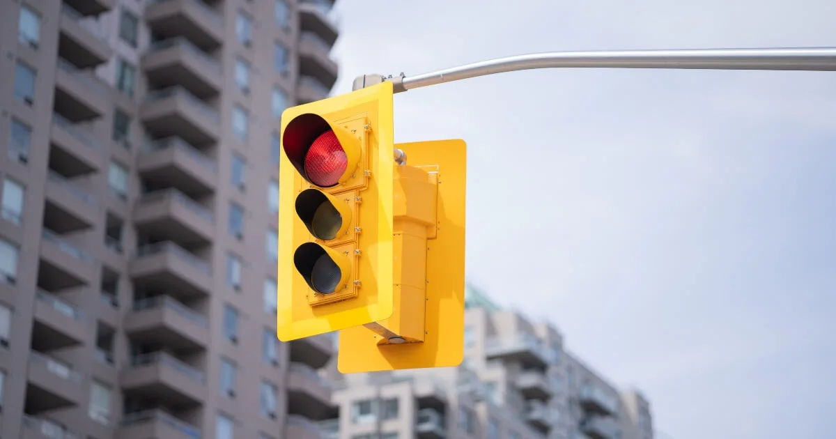 Red light with blurred downtown area in Canada in background